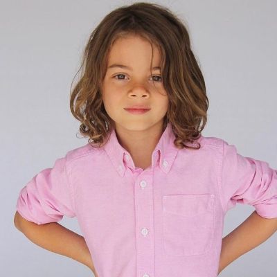 Childhood pictures of Brecken Merrill with long hair.